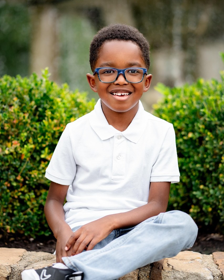 A smiling boy at a Chrysolite Foundation programme